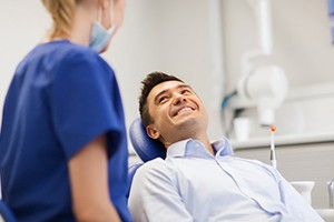 Patient smiling at sedation dentist at dental office